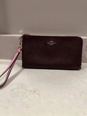 Coach Pebbled Leather Wristlet in Dark Brown with Pink Strap Accent